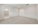 Spacious carpeted bedroom featuring a walk-in shower and closet entrance at 17758 W Getty Dr, Goodyear, AZ 85338