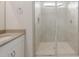 Bright bathroom with a large tiled walk-in shower with glass enclosure at 17758 W Getty Dr, Goodyear, AZ 85338