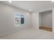 Bright bedroom featuring neutral carpet, a window for natural light, and recessed lighting at 17764 W Getty Dr, Goodyear, AZ 85338