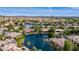 Wide aerial shot capturing a neighborhood around a lake at 1833 W Mead Pl, Chandler, AZ 85248