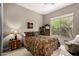 Inviting bedroom with ceiling fan, big window, and warm colors at 1833 W Mead Pl, Chandler, AZ 85248