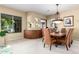Dining room with a view of the water featuring a modern chandelier and a custom built-in buffet at 1833 W Mead Pl, Chandler, AZ 85248