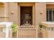 Charming gated entryway with a decorative door, potted plants, and decorative gate at 1833 W Mead Pl, Chandler, AZ 85248