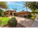 Charming single-story home with a well-manicured lawn, mature landscaping, and a spacious three-car garage at 1833 W Mead Pl, Chandler, AZ 85248