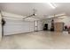 Spacious three car garage with ample storage cabinets, room for vehicles and projects at 1833 W Mead Pl, Chandler, AZ 85248