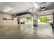 Clean and spacious garage featuring built-in cabinetry and a partially open door at 1833 W Mead Pl, Chandler, AZ 85248