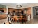 Open kitchen boasts custom cabinets, a center island with barstool seating, and a tile floor at 1833 W Mead Pl, Chandler, AZ 85248