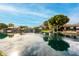 Picturesque waterfront view with lush green landscaping reflects blue sky creating a tranquil and inviting setting at 1833 W Mead Pl, Chandler, AZ 85248