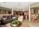 Open-concept living room flows into a spacious kitchen with a central island and bar stool seating at 1833 W Mead Pl, Chandler, AZ 85248