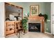 Inviting living room showcases a fireplace with stone surround and built-in shelving at 1833 W Mead Pl, Chandler, AZ 85248