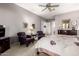 Cozy main bedroom featuring neutral colors, a ceiling fan, and furniture at 1833 W Mead Pl, Chandler, AZ 85248