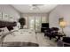 Inviting main bedroom with ceiling fan, calm colors, and backyard access through French doors at 1833 W Mead Pl, Chandler, AZ 85248