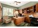 Office space with built-in shelves, desk, and a comfortable window seat at 1833 W Mead Pl, Chandler, AZ 85248