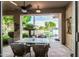 Covered patio featuring outdoor dining furniture and a waterfront view at 1833 W Mead Pl, Chandler, AZ 85248