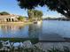 Scenic waterfront view with a dock and patio area for enjoying the tranquil lake setting at 1833 W Mead Pl, Chandler, AZ 85248