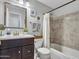 Cozy bathroom with decorative mirror and tiled shower and tub at 18820 N 34Th Ln # 1, Phoenix, AZ 85027