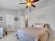 Bright bedroom with a ceiling fan and a comfortable bed at 18820 N 34Th Ln # 1, Phoenix, AZ 85027