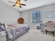 Comfortable bedroom with a cozy chair and natural lighting at 18820 N 34Th Ln # 1, Phoenix, AZ 85027