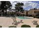 Relaxing community pool area with lounge chairs and mature trees is perfect for a refreshing outdoor retreat at 18820 N 34Th Ln # 1, Phoenix, AZ 85027
