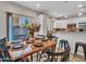 Dining room with wood table and chairs is near kitchen and provides access to backyard at 18820 N 34Th Ln # 1, Phoenix, AZ 85027