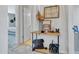 Inviting entryway with stylish wooden table, neutral decor, and a glimpse into a bedroom at 18820 N 34Th Ln # 1, Phoenix, AZ 85027