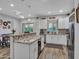 Open kitchen design with stainless steel appliances, granite countertops, and island seating at 18820 N 34Th Ln # 1, Phoenix, AZ 85027