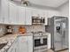 Contemporary kitchen with stainless steel appliances, granite countertops and modern backsplash at 18820 N 34Th Ln # 1, Phoenix, AZ 85027