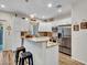 Modern kitchen with stainless steel appliances, white cabinets, and granite countertops at 18820 N 34Th Ln # 1, Phoenix, AZ 85027