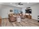 Inviting living room featuring modern flooring and a plush sectional sofa at 18820 N 34Th Ln # 1, Phoenix, AZ 85027