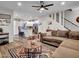 Well-lit living room connected to a modern kitchen with sleek appliances at 18820 N 34Th Ln # 1, Phoenix, AZ 85027