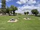 View of the neighborhood park area with tables and green space at 18820 N 34Th Ln # 1, Phoenix, AZ 85027