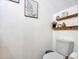 Bright bathroom with toilet, shelf and framed print art at 18820 N 34Th Ln # 1, Phoenix, AZ 85027