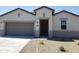 Charming single-story home featuring a low-maintenance desert-style front yard and a two car garage at 18823 E Bruno Dr, Gold Canyon, AZ 85118