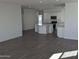 Open-concept living room showcases modern flooring and an adjacent kitchen for easy entertaining and Gathering gatherings at 18823 E Bruno Dr, Gold Canyon, AZ 85118