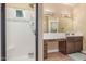 Modern bathroom featuring a shower and vanity with a long mirror at 18934 E Happy Rd, Queen Creek, AZ 85142