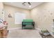Playful bedroom featuring a crib, a window, and a variety of toys at 18934 E Happy Rd, Queen Creek, AZ 85142