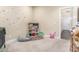 Playful bedroom featuring a shelves, a window, and a variety of toys at 18934 E Happy Rd, Queen Creek, AZ 85142