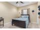 Simple bedroom with a classic bed, a desk, and carpet flooring at 18934 E Happy Rd, Queen Creek, AZ 85142