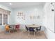 Bright learning space with round tables and colorful learning decorations for preschool education at 18934 E Happy Rd, Queen Creek, AZ 85142