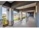 Inviting covered patio with swings, providing an ideal place to relax and enjoy the scenic surroundings at 18934 E Happy Rd, Queen Creek, AZ 85142