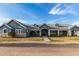 Charming single-story home featuring a well-manicured lawn, inviting entrance, and classic architectural details at 18934 E Happy Rd, Queen Creek, AZ 85142