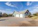 A detached three car garage with an extra-long driveway and lots of parking at 18934 E Happy Rd, Queen Creek, AZ 85142