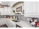 Beautiful kitchen with granite countertops, a stainless steel sink, and designer backsplash at 18934 E Happy Rd, Queen Creek, AZ 85142