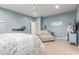Serene main bedroom with a ceiling fan, a comfortable chaise lounge, and plenty of space at 18934 E Happy Rd, Queen Creek, AZ 85142