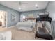 Spacious main bedroom featuring a ceiling fan, plush carpet, and ample natural light at 18934 E Happy Rd, Queen Creek, AZ 85142