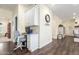 Charming home office with built in desk, with wood look flooring and plenty of storage space at 18934 E Happy Rd, Queen Creek, AZ 85142