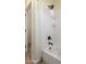 Bathroom with a white shower featuring black hardware, a shower caddy, and wood look flooring at 18934 E Happy Rd, Queen Creek, AZ 85142