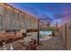 Inviting backyard features a pool, spa, covered patio, and low-maintenance landscaping, perfect for outdoor living at 1916 E Dubois Ave, Gilbert, AZ 85298