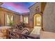 Inviting courtyard with outdoor seating, a wrought-iron gate, and a welcoming front entrance at 1916 E Dubois Ave, Gilbert, AZ 85298