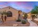 Beautiful home boasting desert landscaping, stone detail, and a charming walkway to the front entrance at 1916 E Dubois Ave, Gilbert, AZ 85298